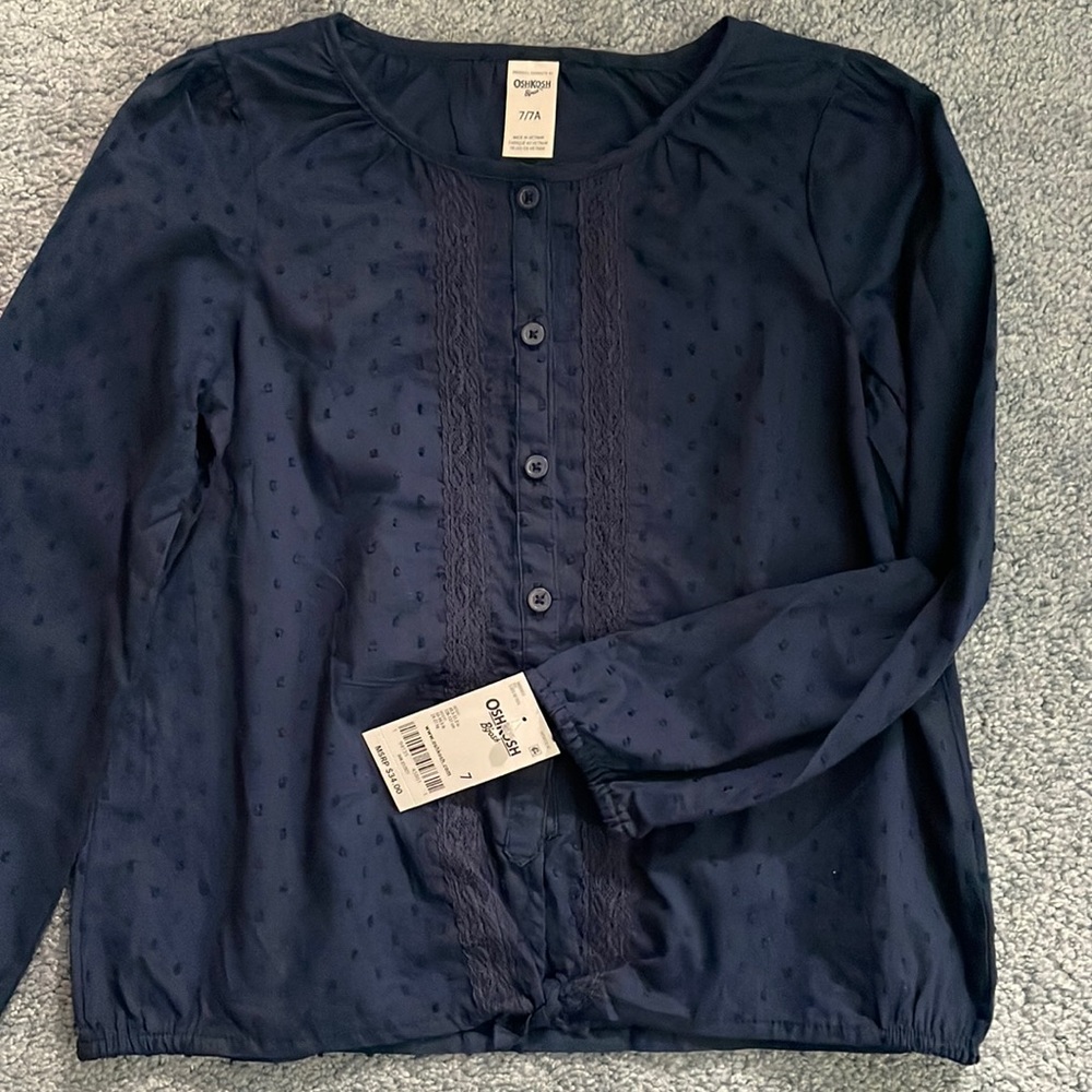 Girls size 7/7a Oshkosh long sleeve navy blue shirt, new with tags.